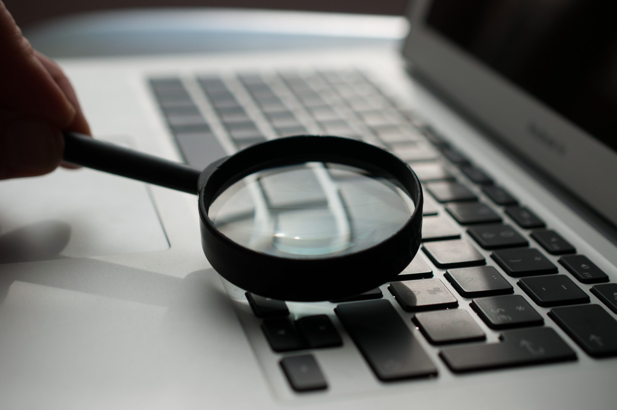 Magnifying glass over keyboard searchandising